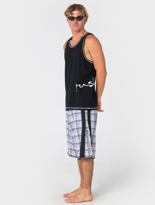 Rusty Crisis Men's Tank in black on model in check boardshorts from the side