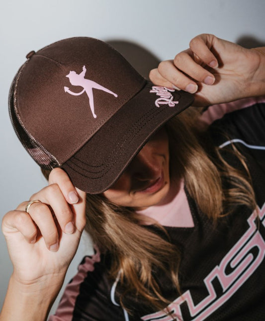 Rusty Crush Womens Trucker Cap in brown colourway on model's head
