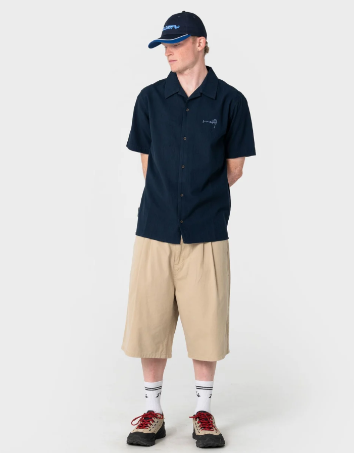 Rusty Daddy Panel Dad Cap in navy colourway on model in khaki shorts and navy shirt