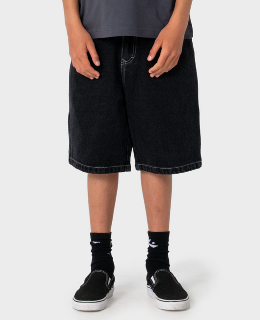 Rusty Dr Dot Baggy Boys Denim Shorts in blackout colour on boy in Rusty t-shirt from the front close up