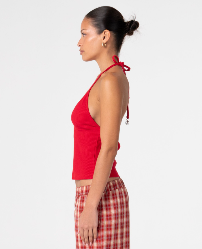 Rusty Emma Cut Out Skimmer Tank in red on model from the side in red checked long shorts