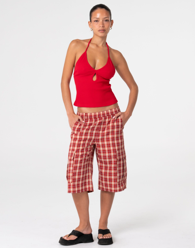 Rusty Emma Cut Out Skimmer Tank in red on model from the front in red checked long shorts