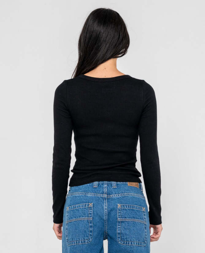 Rusty Essentials Long Sleeve Fitted Tee in black on model in blue jeans from  rear
