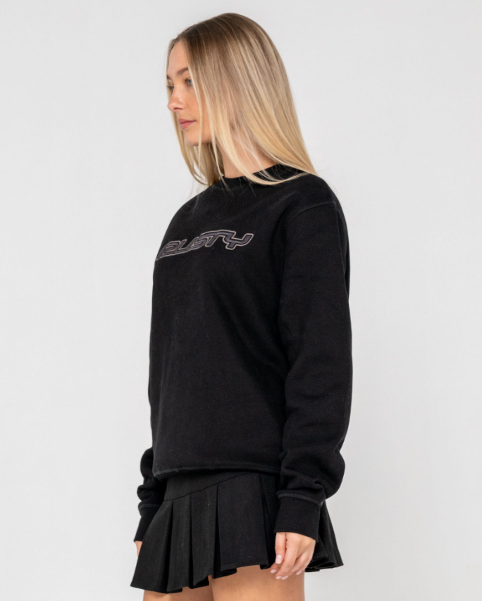 Rusty Essential Oversized Crew Fleece in black on model from side view