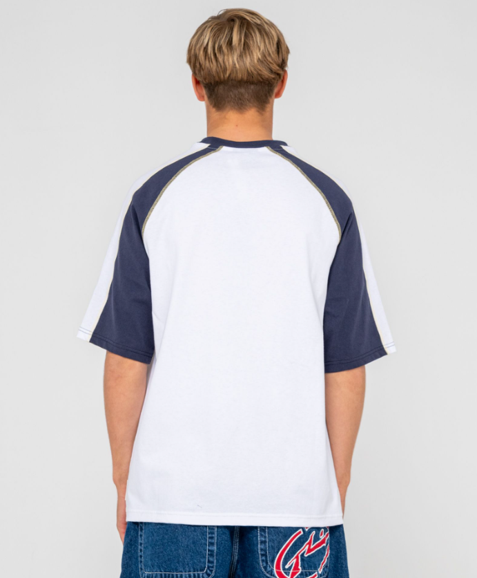 Rusty Fade-R Short Sleeve Tee in white with navy detail on model from rear