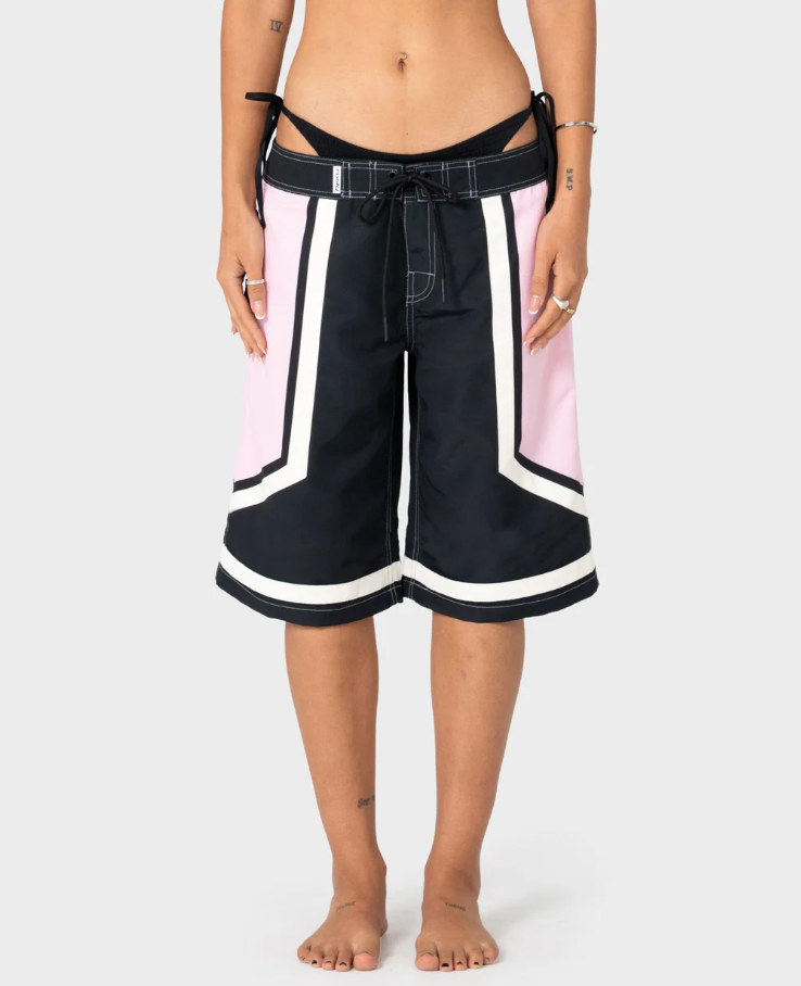 Rusty Farrah Long Women's Boardshorts in black and pink on model from front close up