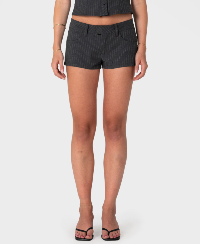 Rusty Finance Mummy Low Rise Suit Shorts in grey pinstripe on model from the front close up