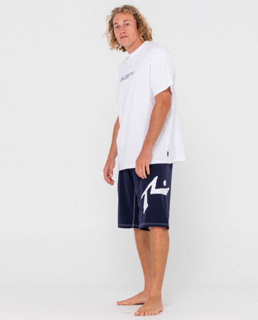 Rusty Fixed Competition Revolution 23" Boardshorts in navy on model in white t-shirt