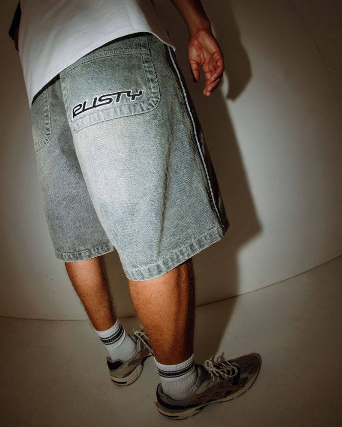 Rusty Flip Daddy Draggin 24" Denim Shorts in dirty dawg colourway on model from rear