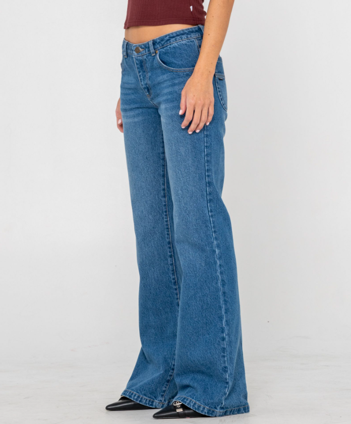 Rusty Freida Flare Low Rise Women's Jeans in blasted middie blue from side