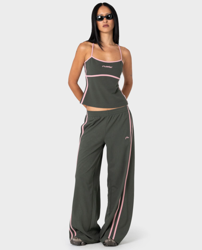 Rusty Freo King Fitted Top in savannah colourway with pink trim on model in Rusty track pants from the front