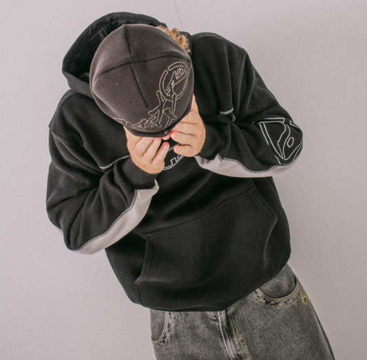 Rusty Hoodus Men's Beanie in black on model in black beanie hoodie from above