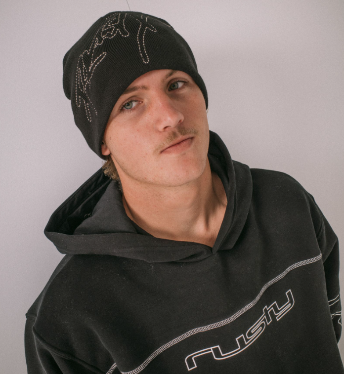 Rusty Hoodus Men's Beanie in black on model in black beanie hoodie