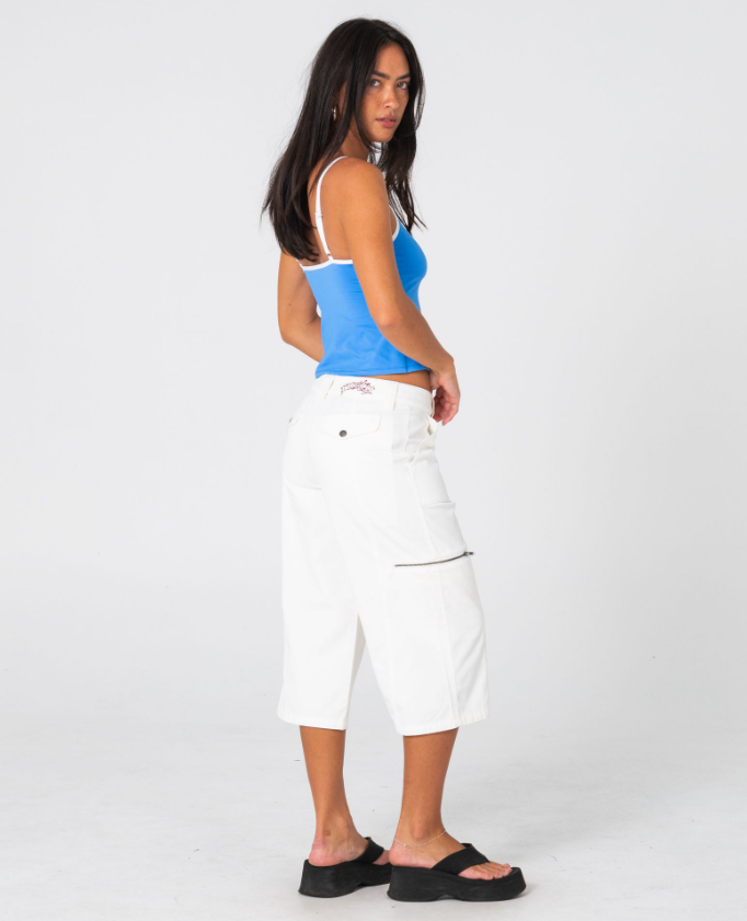 Rusty It Gyrl Low Rise Capri Cargo Pant in white on model in blue tank from the back