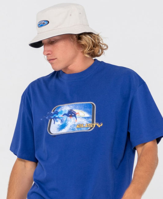 Rusty Kick Flip Reversible Bucket Hat  in oatmeal on model in blue tee