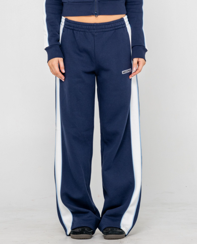 Rusty Retro Lines Wide Leg Women's Track Pants in navy with white side stripe on model from front close up