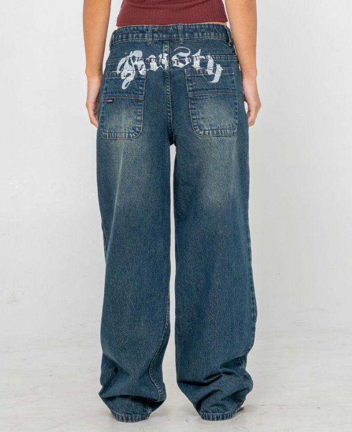 Rusty Roxanne Baggy Low Rise Women's Jeans in dark n dirty blue colourway from rear showing Rusty bum printing