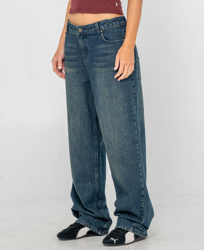 Rusty Roxanne Baggy Low Rise Women's Jeans in dark n dirty blue colourway from side front view