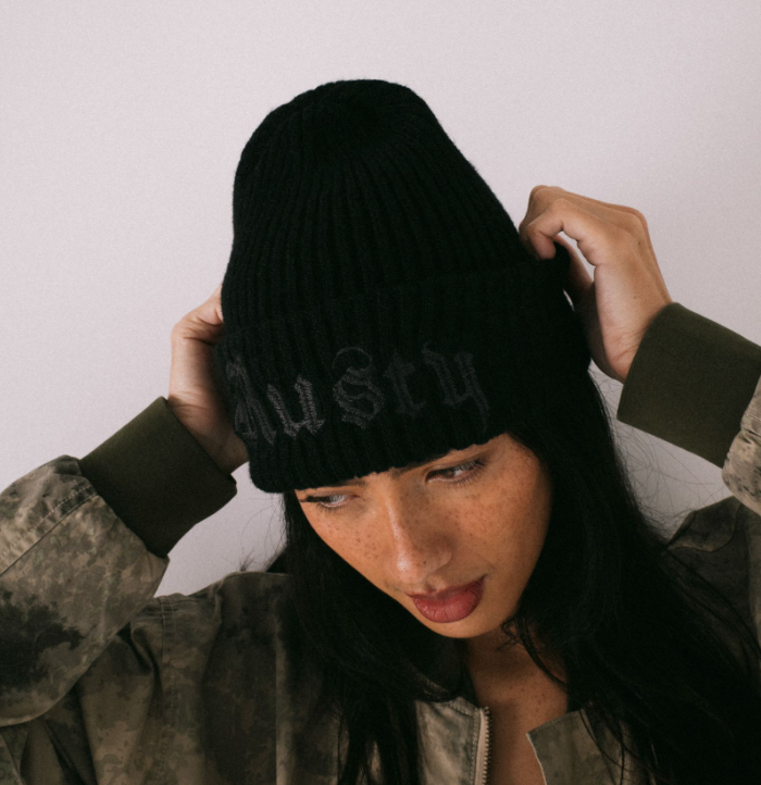 Rusty Roxanne Women's Beanie in black on woman model from front/above view