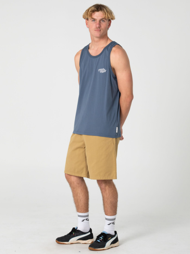 Rusty Rumble Elastic Waist 21" Men's Walkshorts in khaki on model in blue Rusty singlet from side