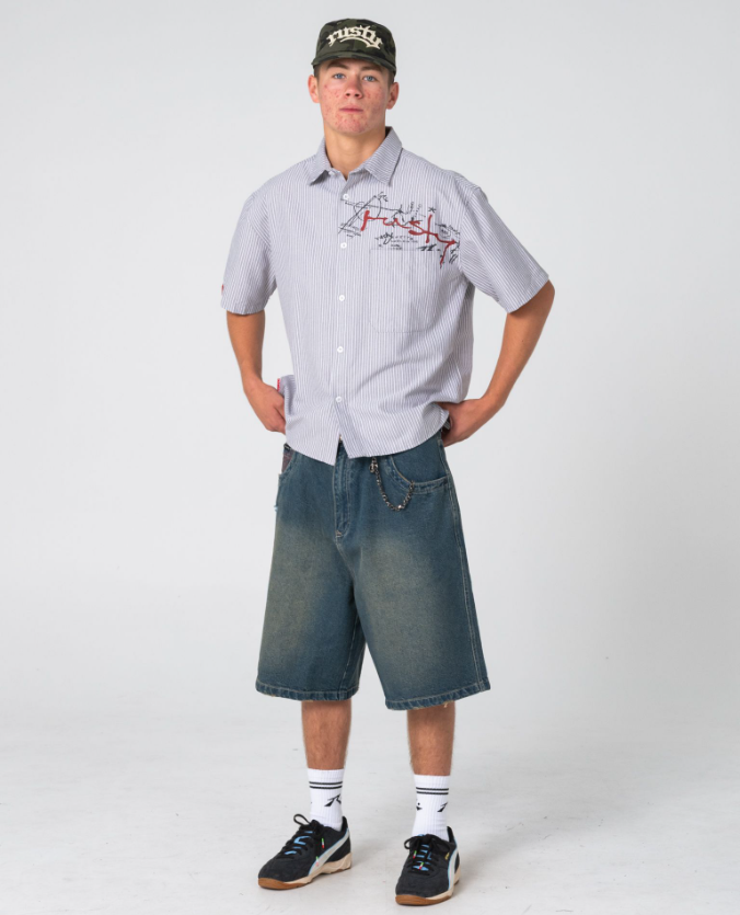Rusty Shockwave Short Sleeve Shirt in grey colourway on model in blue denim shorts