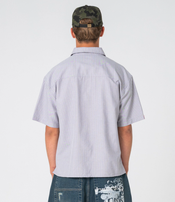 Rusty Shockwave Short Sleeve Shirt in grey colourway on model in blue denim shorts from rear