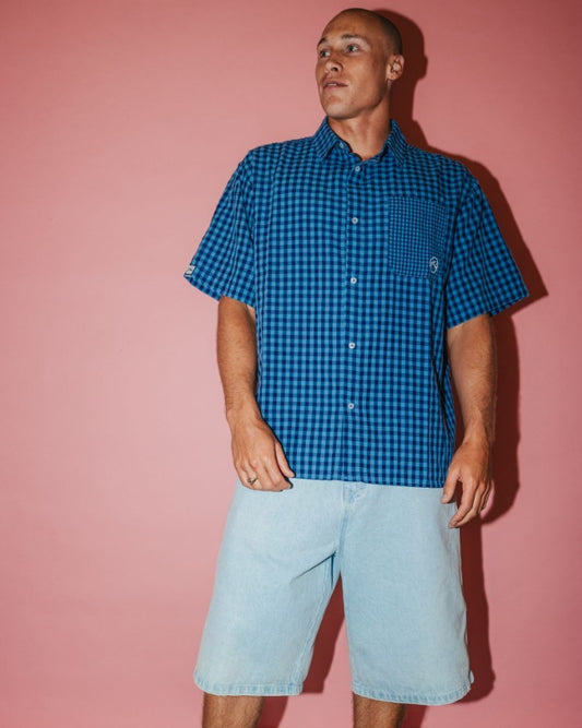 Rusty Slappa 26" Jorts - Denim Shorts in sky blue heather on model wearing blue checked shirt