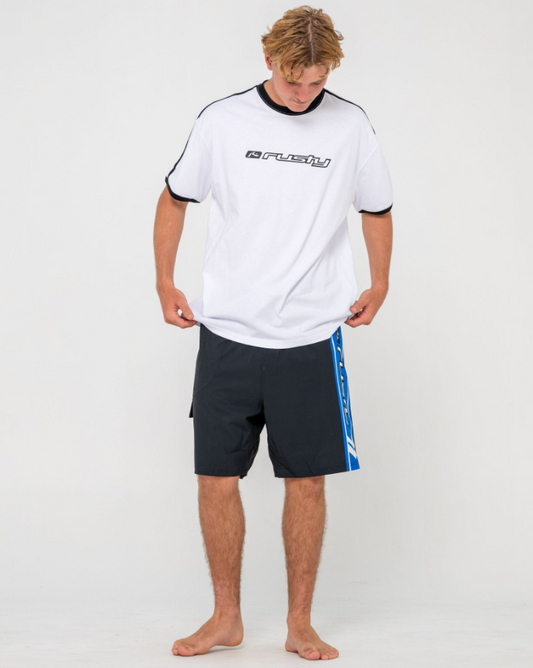 Rusty Spitfire Hybrid Waist 21" Boardshorts in black with blue detailing on model in white Rusty tee
