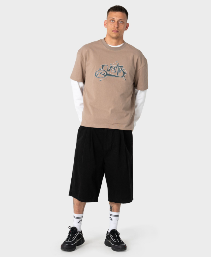 Rusty Spray N Pray Men's T-Shirt in mushroom colourway on model in long black shorts from front