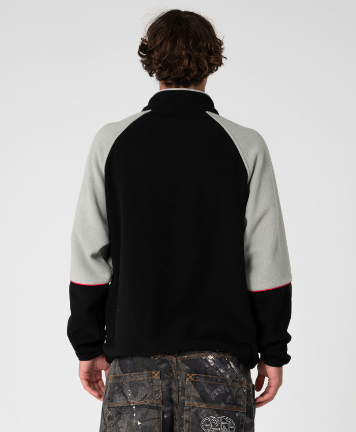 Rusty Tectonic Quarter Zip Polar Fleece in black on model from rear