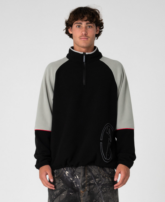 Rusty Tectonic Quarter Zip Polar Fleece in black on model from front