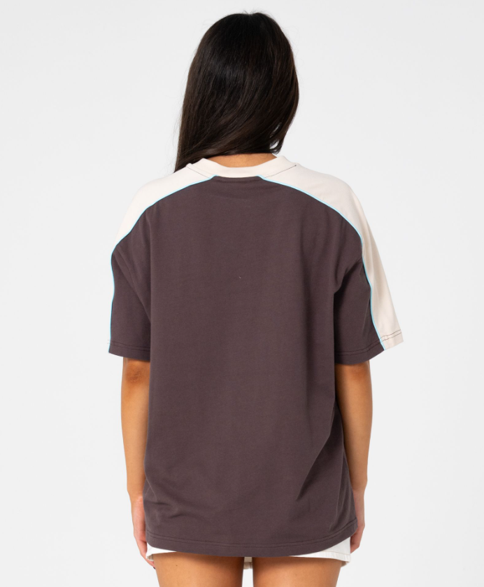 Rusty Timmy Target 220 Oversized Women's Tee in java with cream detail on model from the rear