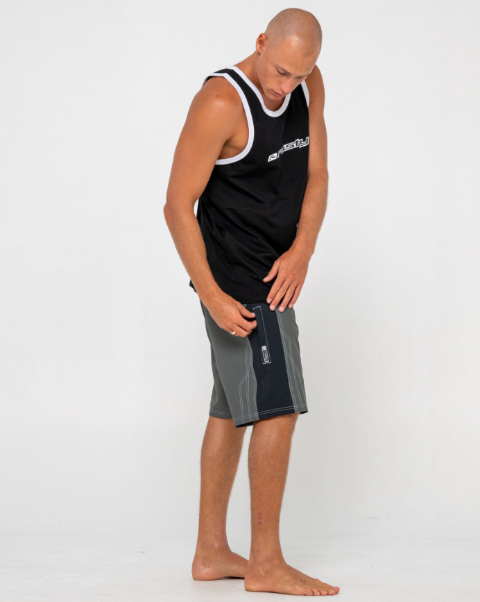 Rusty Tombstones Fixed Waist 21" Boardshorts in army green from side on model in black rusty singlet