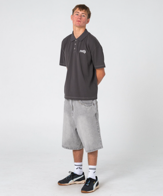 Rusty Turbo 2.0 Baggy 24" Denim Shorts in storm grey colourway on model in Rusty polo
