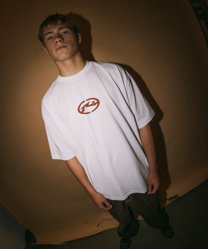 Rusty Turbo Men's T-Shirt in white on model wearing dark jeans from front