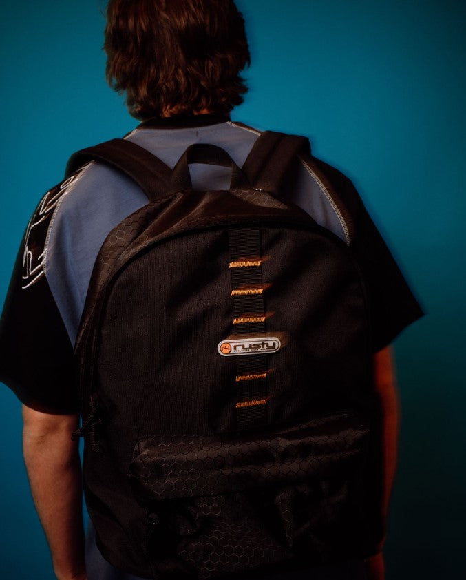 Rusty Voltage Backpack in black on a model's back