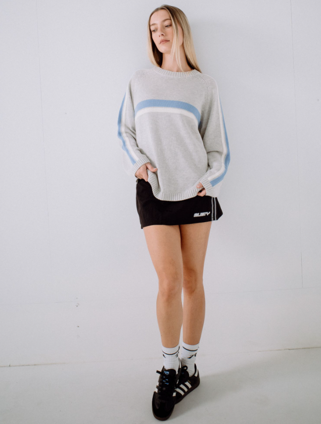 Rusty White Lines Long Sleeve Women's Knit in grey marle with blue and white stripe detail on model from front