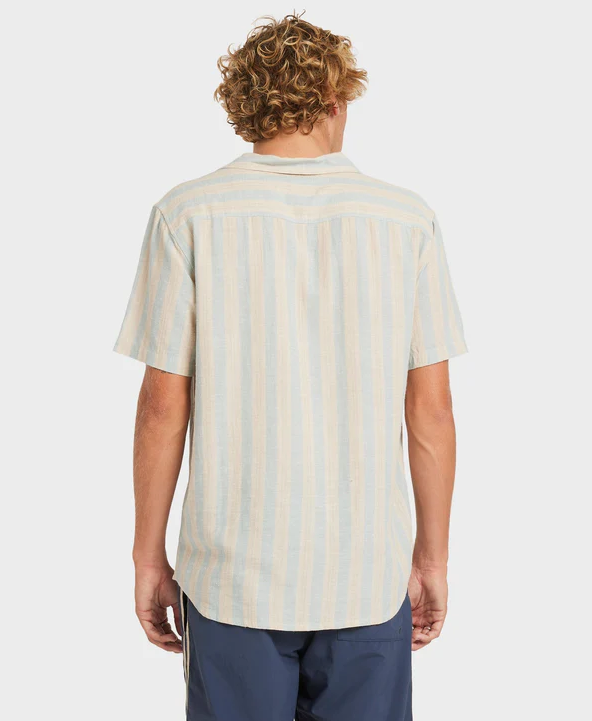 RVCA Beat Stripe Short Sleeve Shirt in striped chambray colourway from rear on blond model