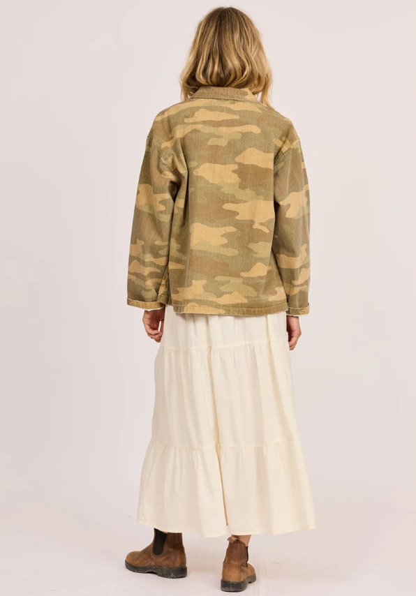 Sisstrevolution Golden Coast Jacket in rattan camouflage colourway on model in cream skirt from rear view