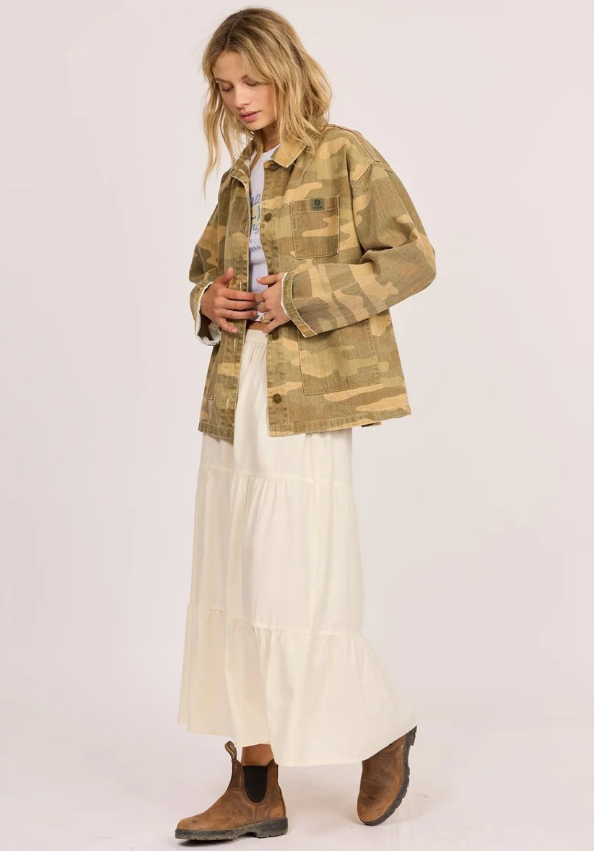 Sisstrevolution Golden Coast Jacket in rattan camouflage colourway on model in cream skirt from side
