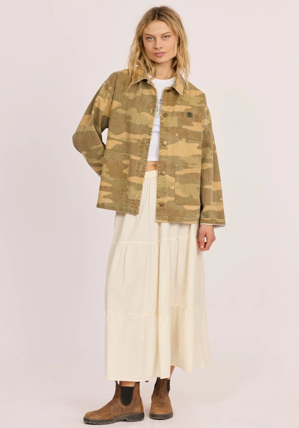Sisstrevolution Golden Coast Jacket in rattan camouflage colourway on model in cream skirt from front view