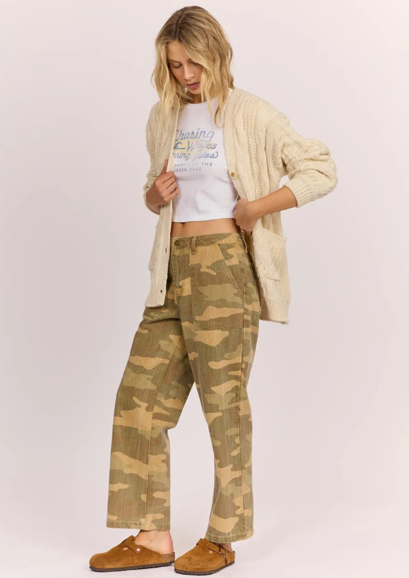 Sisstrevolution Hide and Seek Womens Camo Pants in rattan camo colourway on model in cream knit top from side