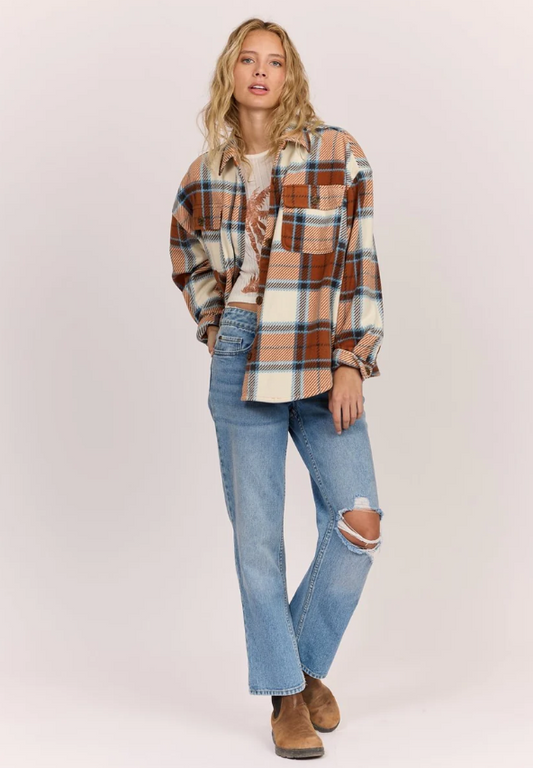 Sisstrevolution Washed Ashore Women's Fleece in terracotta colourway on model in blue jeans from front