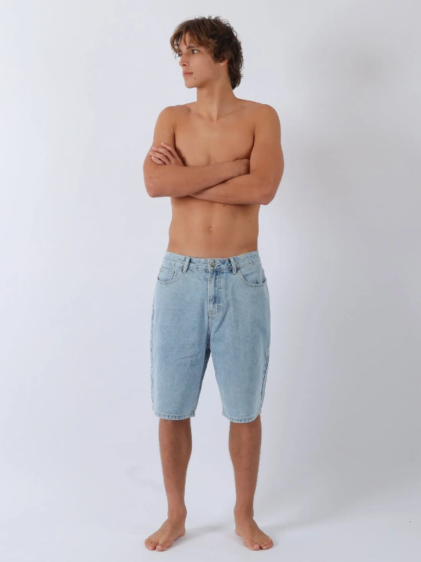 T & C Thrift Boys Denim Shorts in washed blue on model from the front