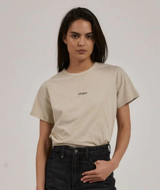 Dark haired model wearing the Thrills Women's Relaxed Tee in oatmeal from front