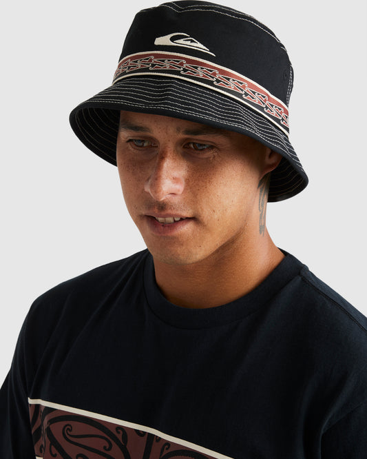 Quiksilver Tawhiro Bucket Hat in black with Maori paneling on Kehu Butler's head