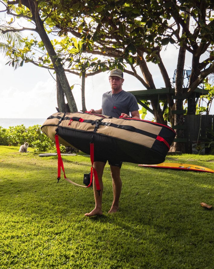 John John Florence carrying the Veia Supplies 6'6 Four Surfboard Travel Bag

