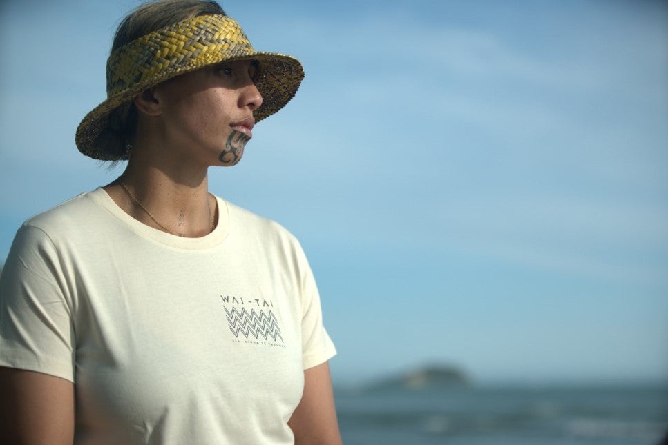 Wai-Tai Womens Ika Tee in ecru colourway from front on model at Kaiti Beach in Gisborne