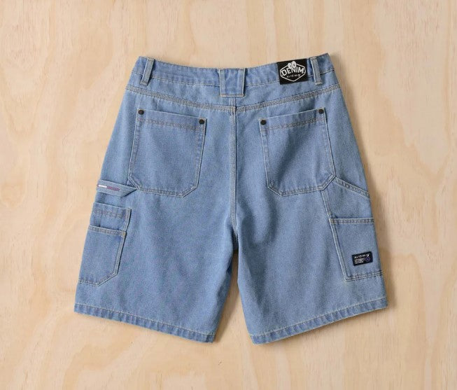 X-DMG X23 Denim Shorts in mid blue denim from rear