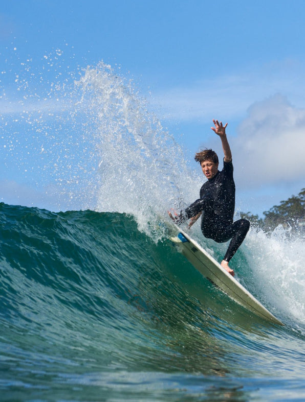 O'Neill sponsored youth pro surfer doing a layback snap on his surfboard